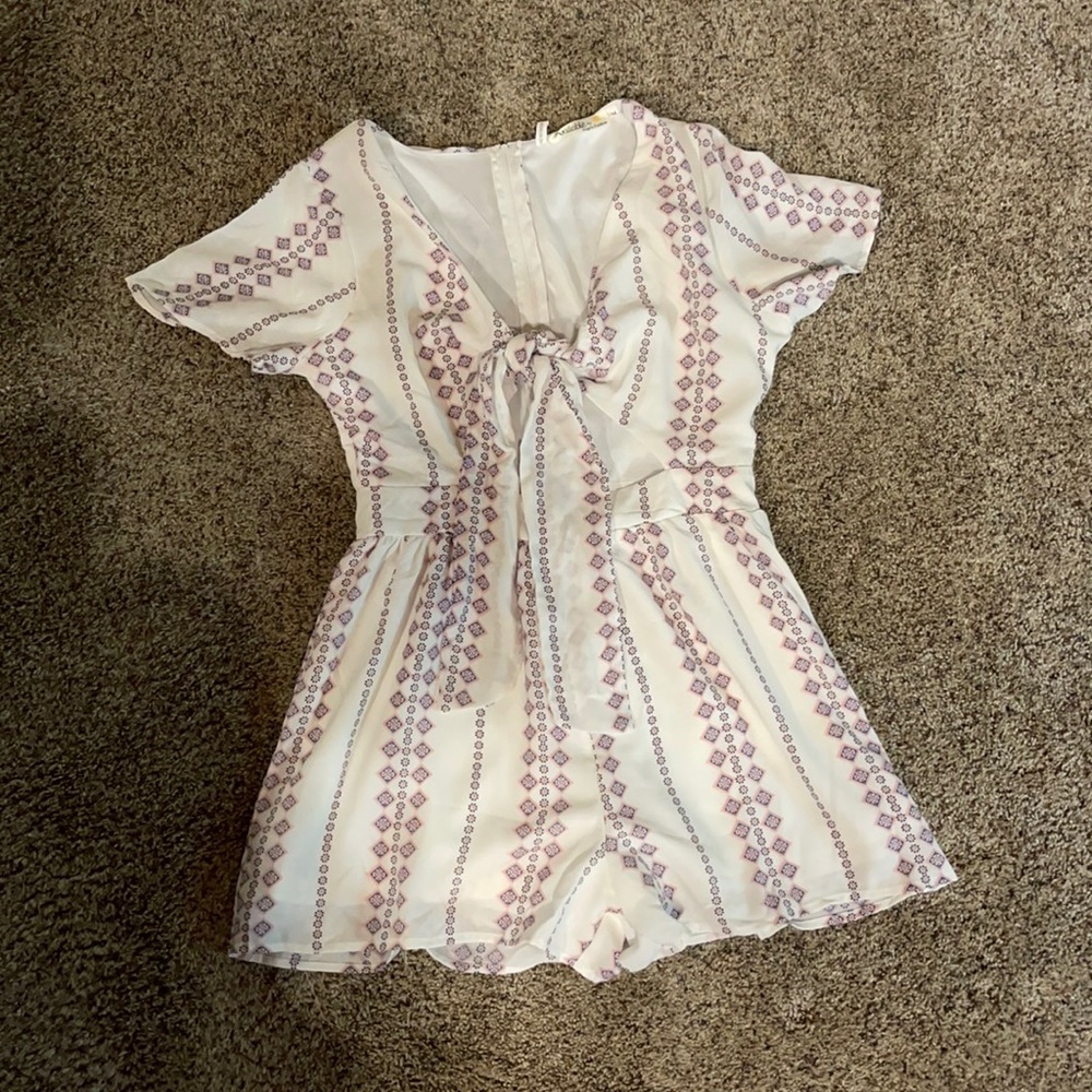 “Available by Angela”Tie front white romper